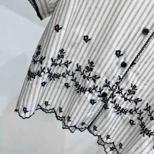 Iris embroidered top